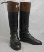 A pair of vintage leather riding boots