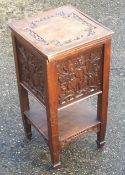 A carved oak sewing box