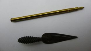 A silver trowel form page marker and a propelling pencil