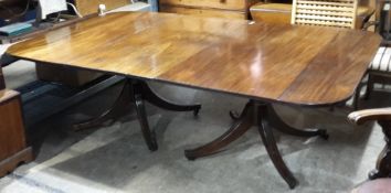 A Georgian mahogany twin pillar dining table