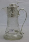 A silver plated claret jug