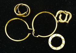 A collection of gold and yellow metal jewellery