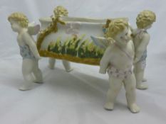 A rectangular porcelain cherub centrepiece