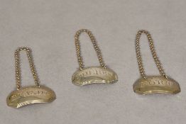 Three early 19th century silver decanter labels,