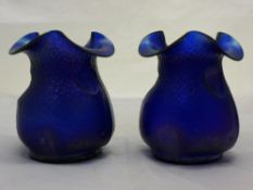 A pair of Loetz type iridescent glass vases