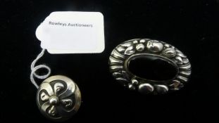 A boxed Georg Jensen silver brooch and a vintage sterling and onyx brooch