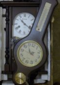 A wall clock and a barometer