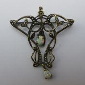 An Art Nouveau opal and marcasite brooch