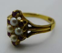 An 18 ct gold ruby and seed pearl ring