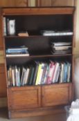 A folding Globe Wernicke type bookcase