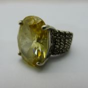 A cubic zirconia and topaz ring