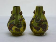 A pair of 19th century Japanese brass and copper vases