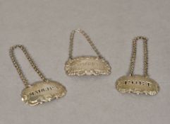 A pair of silver decanter labels, hallmarked probably London 1814, maker's mark of Thomas Phipps,