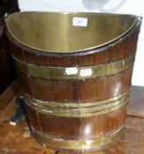 A 19th century brass bound mahogany bucket