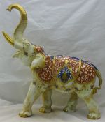 A large 19th century German porcelain model of an elephant,