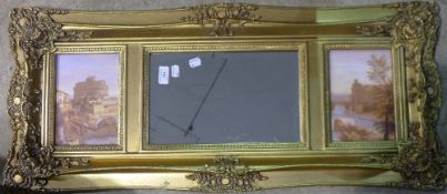 A gilt framed mirror with decorative plaques