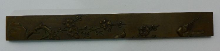 A Chinese bronze scroll weight