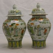 A pair of small Chinese coloured porcelain vases