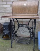 A Singer sewing machine on a treadle base