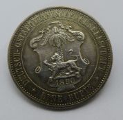 An 1890 German East Africa eine rupie coin with brooch fitment