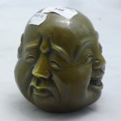 A bronze four faced Buddha head