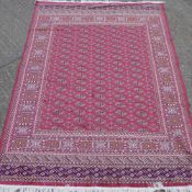 A red ground Bokhara carpet 2.30 x 1.