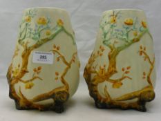 A pair of Clarice Cliff Indian tree pattern moulded vases