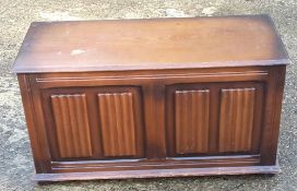 An oak linen fold trunk