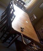 A Victorian walnut two leaf extending dining table