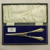 A cased pair of silver handled glove stretchers,