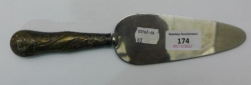 A silver handled server