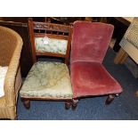 Two Edwardian nursing chairs raised on ring turned supports