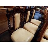 Three Victorian walnut side chairs,