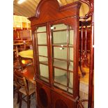 A walnut chequered strung corner display cabinet with cupboard below raised on cabriole supports