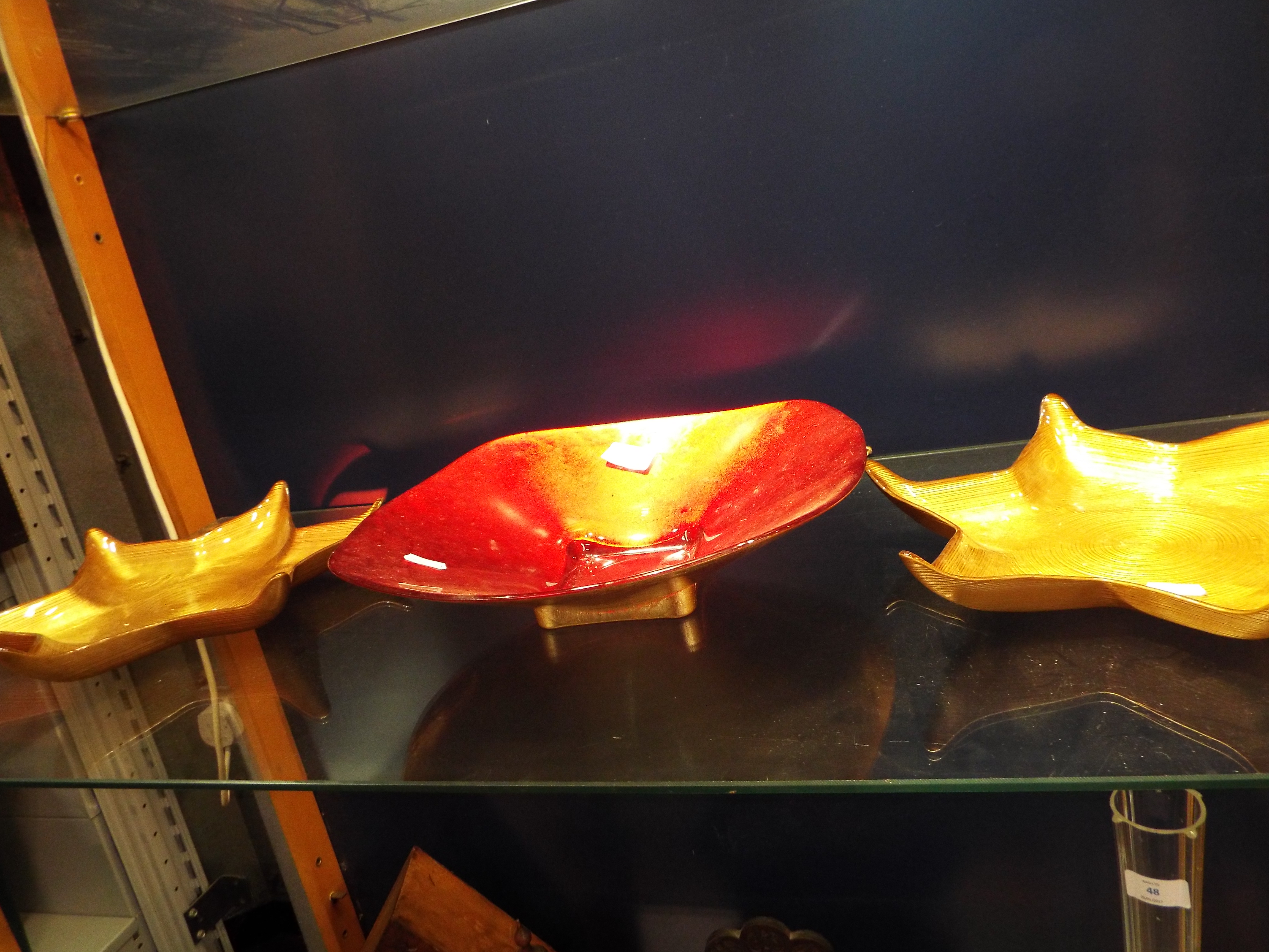 Two foiled glass gold star-shaped dishes and a large red and gold foiled glass dish