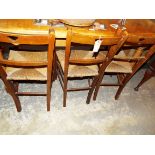 Three mahogany rush seated side chairs with heart shaped pierced top rails