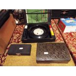 A vintage cased roulette wheel and chips together with a draughts and domino set