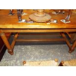 A mid 20thC light oak refectory table,