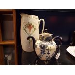 A Doulton cream and blue glazed floral decorated Royles Patent self pouring teapot no 6327,