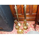 A pair of Middle Eastern brass hexagonal candle stick and matching vase each incised with floral