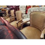 A set of four Queen Anne style elbow chairs in beige upholstery