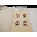 An album housing stamps of British and European Monarchs, leaders,