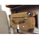 A vintage travelling case with brass Bramah locks