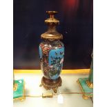 A 20thC cloisonne and bronze mounted lamp having pictorial panel depicting birds,