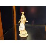 A porcelain Naples figurine of a classical maiden