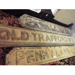 Two reproduction wooden road signs for Old Trafford and Oxford Street,