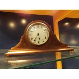 An Edwardian Swiss made walnut dome top mantel clock, the enamel dial with Arabic numeral,