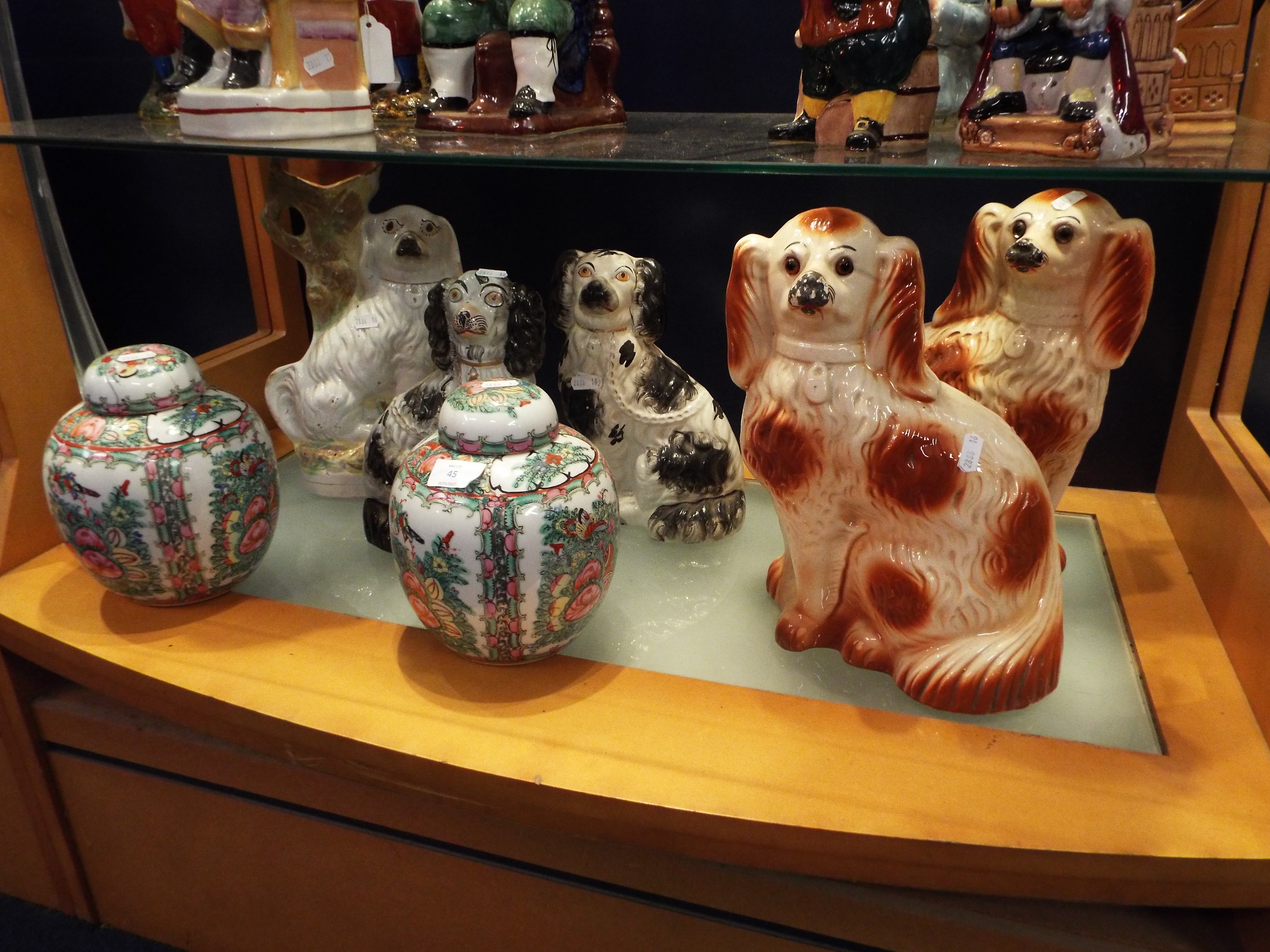 A selection of Staffordshire style seated spaniels and two Oriental ginger jars
