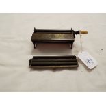 A vintage Evans& Co "The Concinnum" brass rolling machine with bone handle