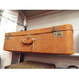 A Harrods of London tan suitcase